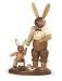 Easter bunny, male, with playing child